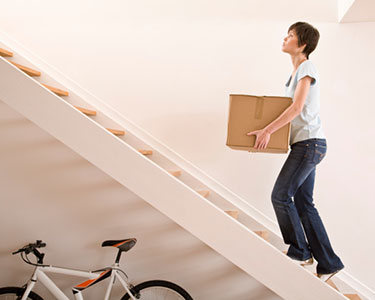 A woman climbing a set of stairs.