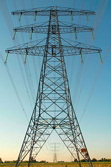 A power line pylon constructed out of metal triangles.