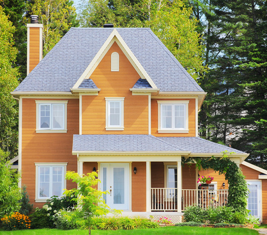 A house with rectangular windows, square panes of glass, a trapezoidal roof.