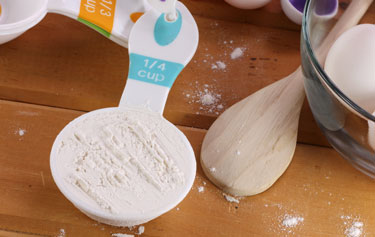 A one-quarter (1/4) cup of flour.