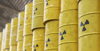 Radioactive waste buckets stored in a factory.