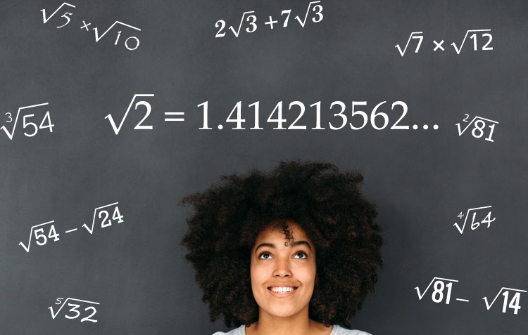 A woman stands in front of a blackboard with several radical expressions written on it.