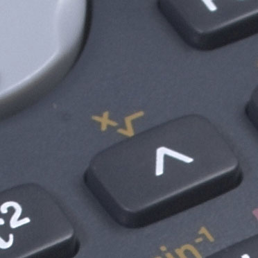 A close up of a scientific calculator showing the x-th root button.