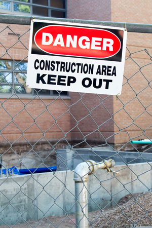 Construction area with a danger sign on the fence.