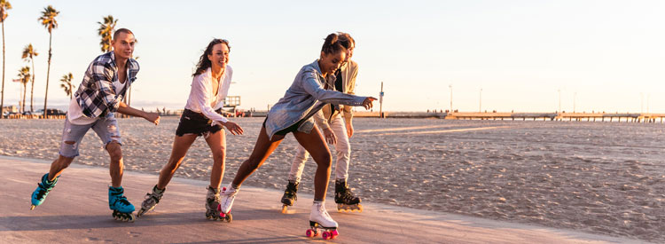 Teenagers roller skating.