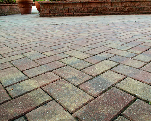 Patio bricks forming a grid of parallel and perpendicular lines
