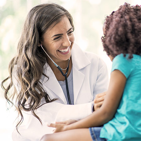 A doctor using a stethoscope