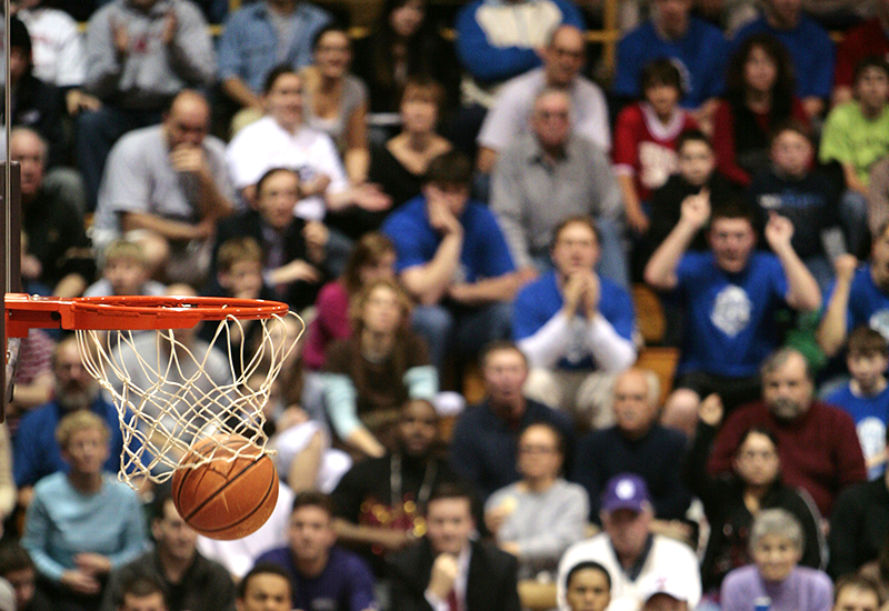A crowd watching a basketball game