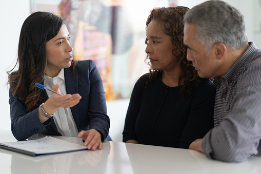 An adviser discussing with a couple.