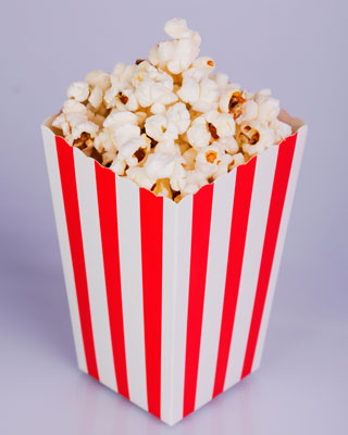A square-based prism holding popcorn.