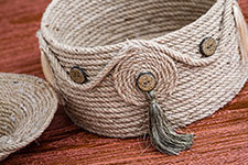 A cylindrical rope basket.