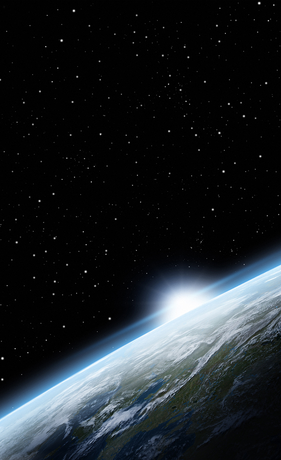 Sun rising over the crest of the earth, seen from space